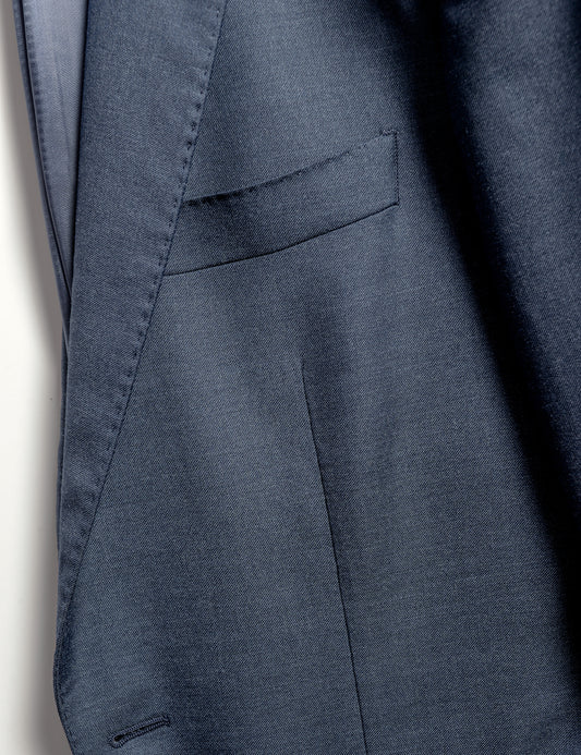 Close up on BKT50 Tailored Jacket in Super 130s Heather Twill - Cool Blue showing fabric detail, lapel and chest pocket