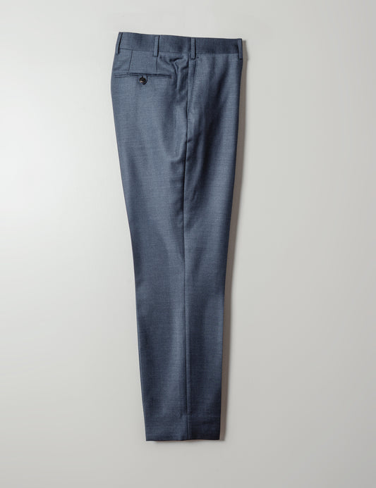 Full length shot of BKT0 Tailored Trousers in Super 130s Heather Twill - Cool Blue against a white backdrop