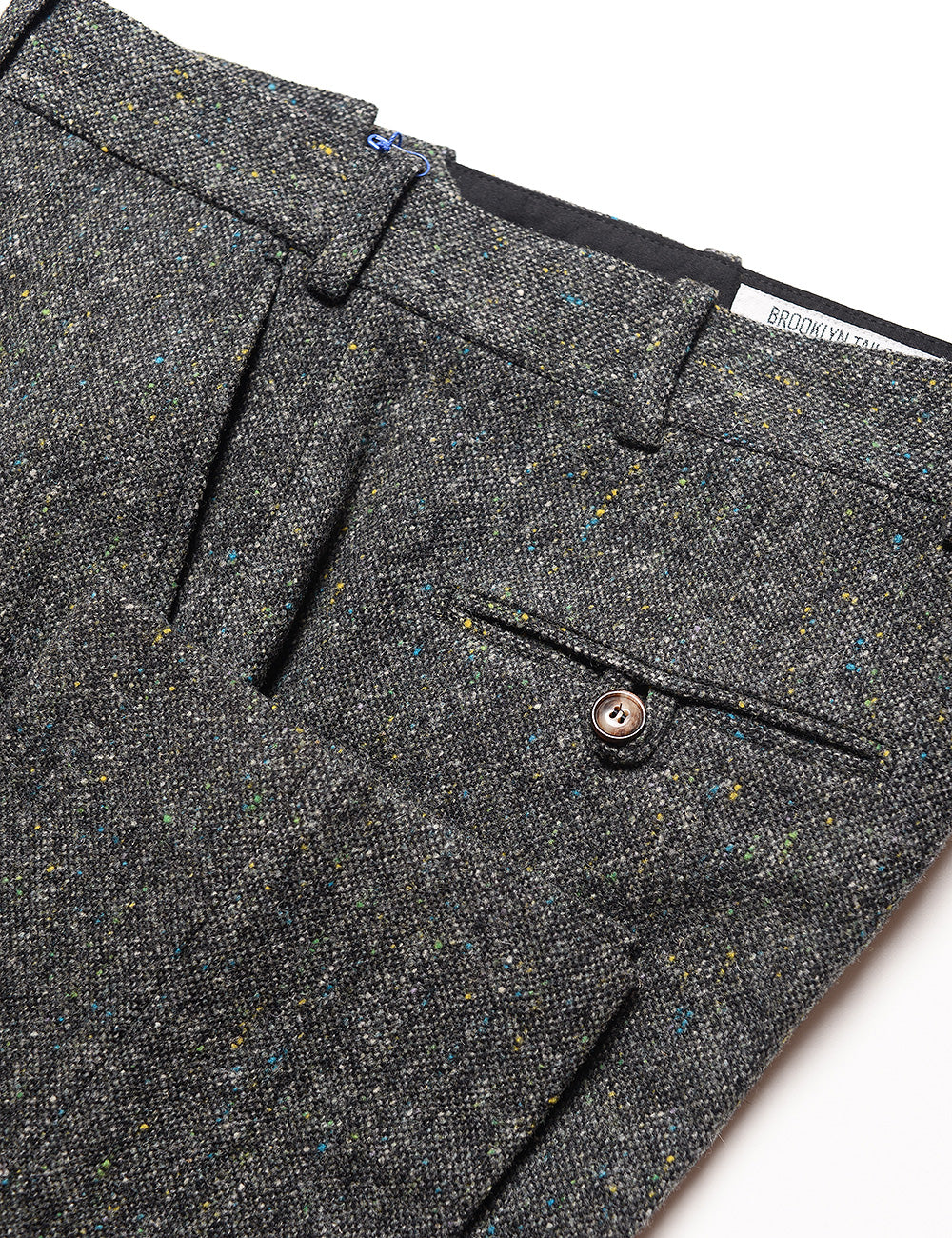 Detail of Brooklyn Tailors BKT50 Tailored Trouser in Flecked Donegal Tweed - Lead Gray showing back pocket, side pocket, cuff, and waistband